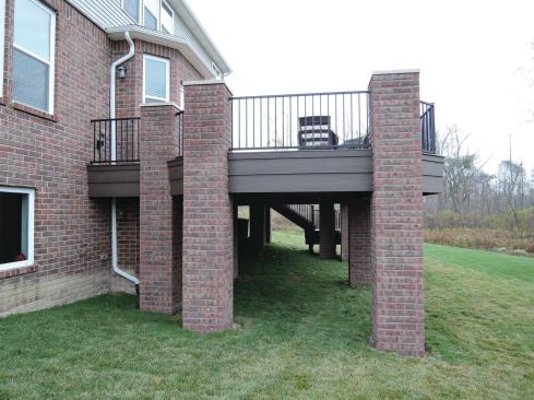 Brick columns don’t actually support this deck, but they’re built as if they did. The masonry requires adequately sized footings for support.
