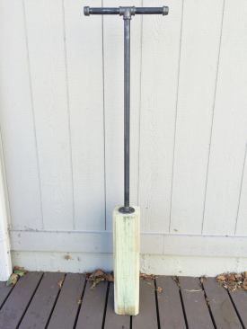 I built my own post-hole tamper from a treated 6x6 and some black gas pipe.