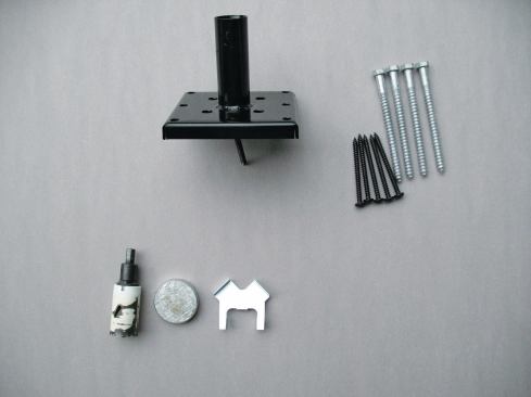 The Titan Post Anchor requires lag screws to secure the base plate to the post and 3-inch-long screws to fasten the base to the decking and blocking. Accessories such as a 1 1/4-inch-diameter hole saw (for drilling a mounting hole into the center of the post), a hammer cap, and a hole-saw centering tool are also available from Titan.