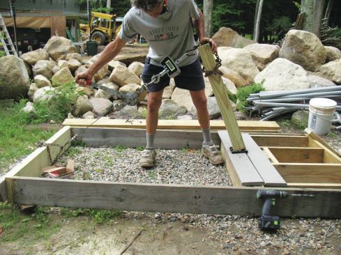 Using double blocking with the grain parallel to the tension force and through-bolts and washers instead of screws improved performance of the Titan anchor, but the top of the post deflected almost 12 inches at 374 lb. of tension.