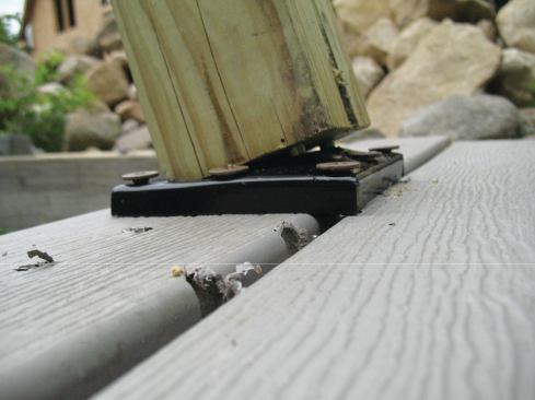 When the Titan Anchor was installed with beefed-up blocking and through-bolts, the bottom of the post split at 374 lb. of tension.