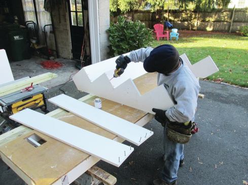 After ripping the PVC risers to size, the author fastened them to the notched skirtboards with PVC glue and countersunk coated deck screws.  