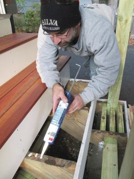 Before installing the hardwood treads, the author applied marine adhesive to the head of each shim screw. 