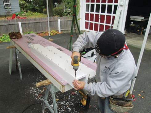 The PVC post wraps were fastened together with glue and countersunk screws spaced 6 inches apart.