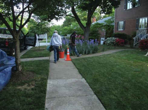 Traffic cones can be used to remind workers to use a walkway.