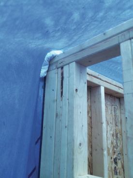 Old towels or insulation scraps placed on sharp corners will help prevent the tarps from tearing.