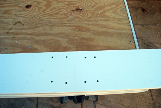 Four more fasteners are used to secure the second length to the substrate while the PVC adhesive in the lap joint cures.