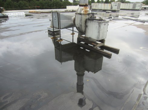 Roof deflection caused by the weight of mechanical equipment that wasn’t accounted for in the original design can lead to ponding.