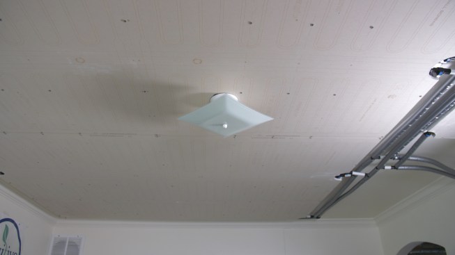 This is how drywall radiant ceiling panels look before they are mudded. The piping (seen to the right on this experimental installation at the Positive Energy offices) would be buried in the ceiling and panels skim coated, so it would look like an ordinary drywall ceiling and you'd never know there were radiant panels inside.