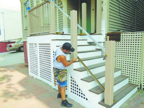 Laying the lower beam across the stair-tread noses is an easy way to find the beam’s length and cut angles.