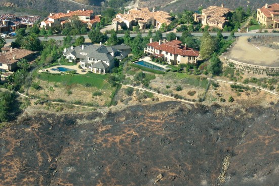 The Bridges, a Lennar Homes luxury development in Rancho Santa Fe, Calif., withstood wildfires that torched hundreds of other buildings in the area by applying "Firewise" landscaping techniques and building details. (Photo by Rancho Santa Fe Fire Protection District)