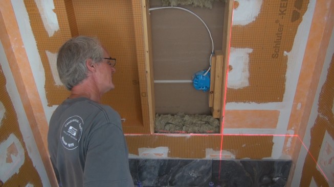 This box installation is complicated by the presence of a bedside lighting receptacle for the next-door bedroom, which can't be relocated. Fortunately, the 2x6 wall framing allows enough depth to hold both the recess box and the wiring box.