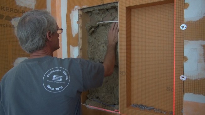 To preserve at least some of the soundproofing effect, Boucher replaces two inches of rock wool in the cavity. 