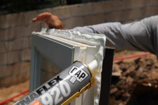 Standard window install method here. We tend to use dap dynaflex 920 on our nailing flanges. Caulk the back side in an inverted “u” shape and leave off the caulk at the sill.