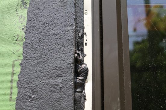 Then after the window is installed and nailed you’ll go back over the nailing flange with more zip liquid flashing. It sticks to the previous liquid flash and you’ve got a water-tight window now!