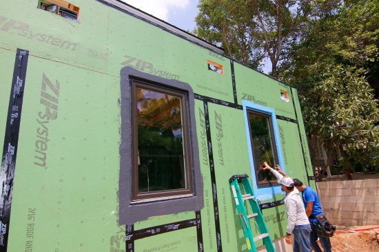 Here is the finished install. The window on the left we used Huber’s Zip Liquid Flash, the blue one on the right uses Poly Wall’s Blue Barrier. As you can see this house has no overhangs and with these recessed windows you need a “Bomber” system to waterpoof. Fluid Applied wins.