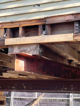 Wherever possible, the house movers located the steel support beams at basement window openings so they wouldn’t interfere with the foundation pour.