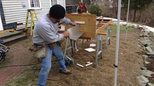I removed the old door threshold and installed an aluminum flashing pan that I had formed with a home-made jig.