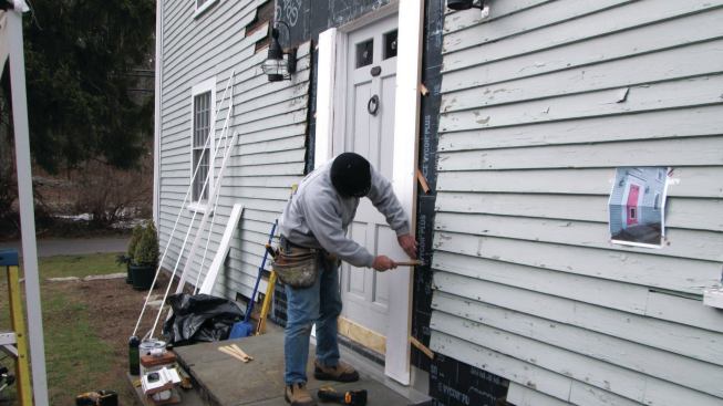 I held the trim about 1/2 inch off the side of the house with blocking strips for drainage and air circulation and fastened it in place with countersunk stainless-steel screws.
