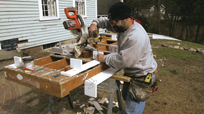 I built the soffit at my workbench in two pieces: a bottom part with attachment blocks and a fascia that wrapped around it.
