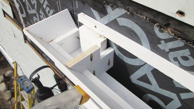 A band of crown molding—with angled blocks reinforcing it from inside — topped off the cornice.