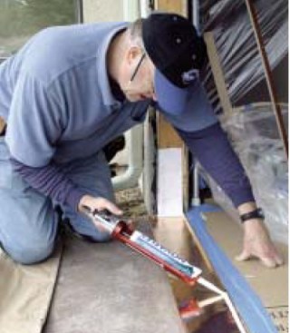 In preparation for the jamb, beads of sealant are applied to the
pan ...