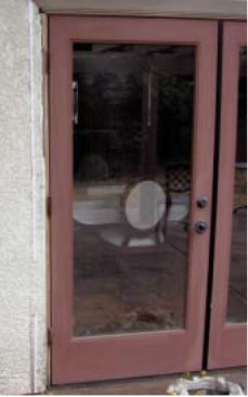 The existing doors stuck in damp weather and leaked air, and their hardware had rusted from coastal exposure.