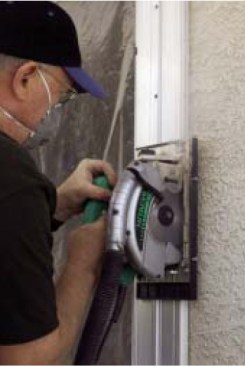 He uses a circular saw and diamond blade to make stopped cuts.