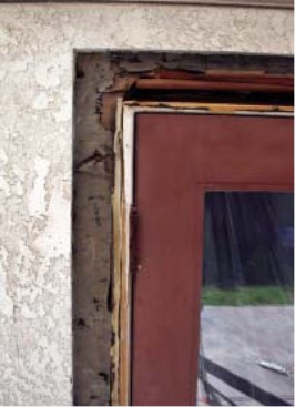 ... only a straight cut edge and a small flap of intact building paper remain.