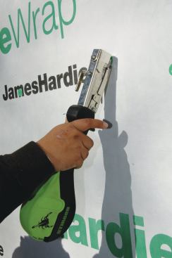 A hand cap stapler works well for installing housewrap. 