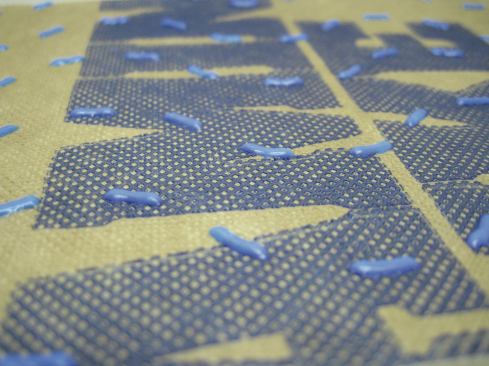 The plastic dots adhered to Benjamin Obdyke's Hydrogap housewrap hold the cladding off the sheathing and provide space for water to drain. This housewrap can be installed in any orientation.