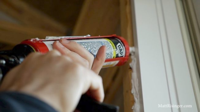 DAP Dynaflex 230 Caulk works well and is not crazy expensive. Assume roughly two tubes per average window.