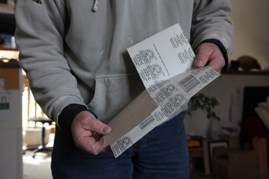 Start folding the sheet, working your way around the center.