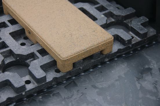 Drainage mat must be used when the grids and pavers are installed directly over a roofing surface.