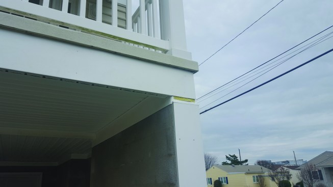 On the bottom of the beam, we installed vented soffit to allow water out and air in, and for both the exterior and interior sides of the upper beams, we used L-shaped bends of aluminum capping.