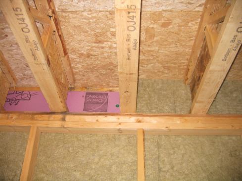 Like any fibrous insulation, Roxul does not stop air, so we were careful to air-seal with rigid board at critical areas, like the band joist, before packing out the wall with Roxul.