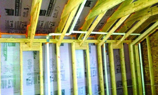 Here, the custom baffle is shown installed in a custom stick-framed roof.