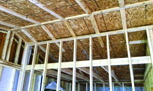 Furred-down chases and dropped ceilings created space for mechanical and electrical systems within the conditioned envelope.