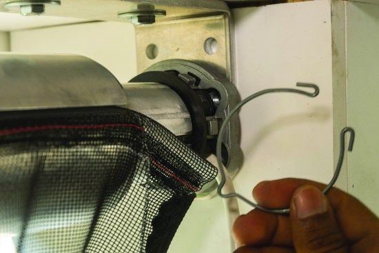 A clip locks the assembly to the mounting bracket.