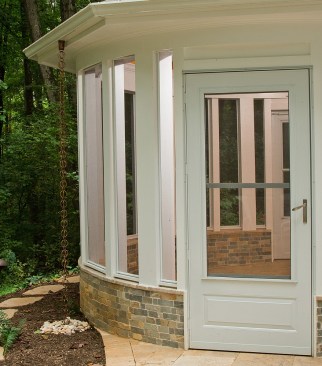 Japanese-style rain chains guide water collected by the gutters away from the walls.