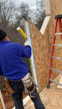 Each 6 1/2-inch-thick panel was manufactured to exact specifications and labeled for its location and sequence in the installation process. The panels arrive with horizontal and vertical ducts ready for electrical wiring. During installation, panels are sealed on all four sides with either spray foam or SIP seal adhesives, depending on the connection.