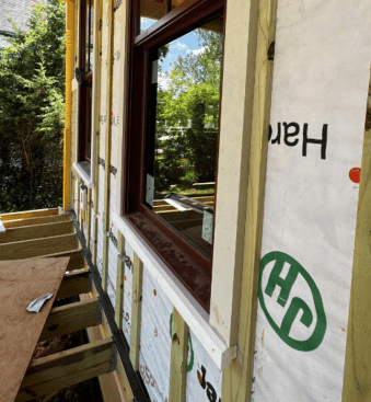 Window trims were installed on top of the rainscreen furring strips, which gave the window sashes a recessed look, a nice architectural detail for a home aspiring to Victorian design.