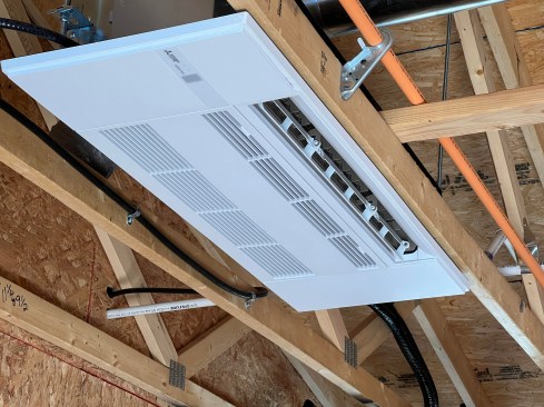 Not all indoor mini-split heat pumps have to be wall units. The author used seven of these Mitsubishi ceiling cassettes on his own home to zone control heating and cooling. These cassettes are very quiet.