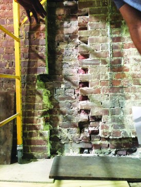 A chimney flue and other irregular surfaces will have to be filled before the wall can be coated.