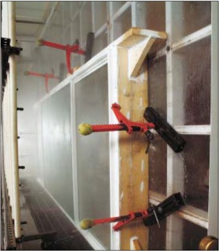 The Water Test: To meet AAMA minimum water penetration rating, a sample window is subjected to a negative pressure equal to 15% or 20% of the design pressure across the inside of the test assembly. The window exterior is then hosed down with a rack of water jets that is equivalent to a rainfall of 8 inches per hour. If any leakage occurs on the interior, the window does not pass.