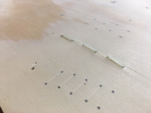 Here, an example of crown staples upon initial firing, then after sanding. This was done on a test board of BC plywood at the demonstration booth at STAFDA to show how the nailers worked, and how easily the fasterners could be sanded. If it's tough to tell, the hole is from a standard nail gun. the successive black spots are the sanded edges of staples. These fill the nail hole and can be painted or stained. 