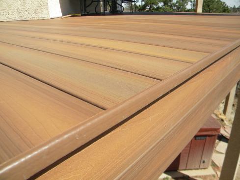 A trim piece that was cut from a length of square-edged decking hides unsightly board ends.
