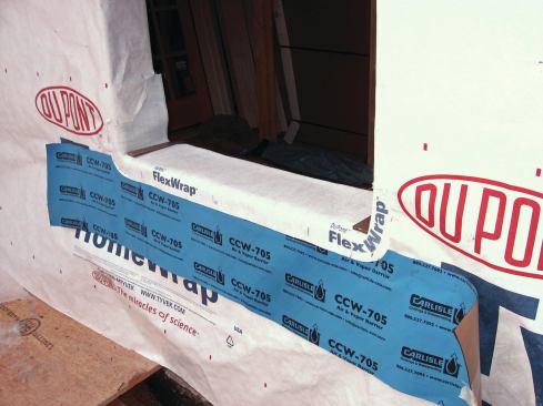 A key feature of a good window flashing is a drainable sill pan, which gathers the water leaking around a window unit and directs it to the outside. We find that a lot of masons, if left to their own devices, will let the sill pan drain into the air space behind the brick, leaving the through-wall flashing at the base of the wall to do all the work. However, we feel that best-practice should include a through-wall flashing right below each window that is integrated with the sill pan. Any water leaking from any window needs a clear path out of the wall as quickly as possible.