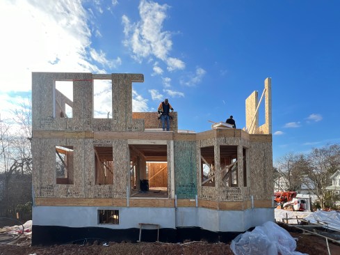The Queen of Zero framing crew installs structural insulated panels (SIPs) on the second story of this Net Zero Ready Home in Maryland. The super-efficient panels have a near continuous “beyond code” thermal resistance of R-24.