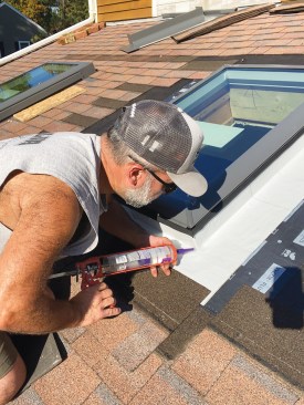 Another diagonal cut allowed the flashing to wrap around the corner. I used a similar detail at the top corners of the unit. After the remaining pieces of flashing were installed up the sides and over the top of the unit with a 6-inch overlap, I filled the small gaps at each of the four corners with clear, flashing-compatible Geocel sealant.